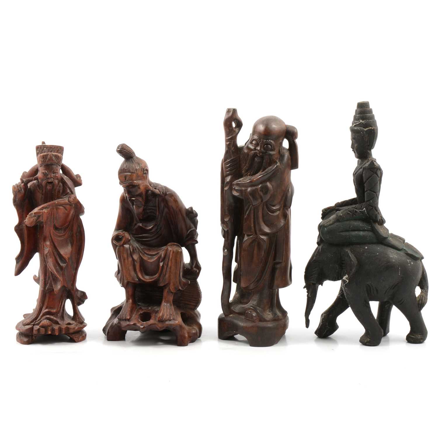 Lot 138 - Four Asian wooden carvings of immortals