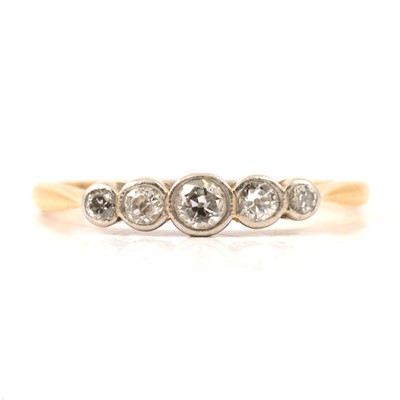 Lot 15 - A diamond five stone ring.