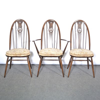 Lot 391 - Ercol dark elm table and six swan-back chairs