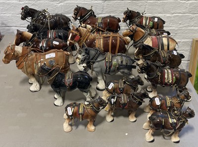 Lot 59 - A collection of nineteen ceramic shire horses, to include Melbaware, Trantham, Token.