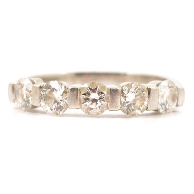 Lot 22 - A diamond half eternity ring.