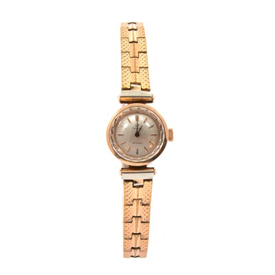 Lot 342 - Omega - a lady's gold-plated bracelet watch.