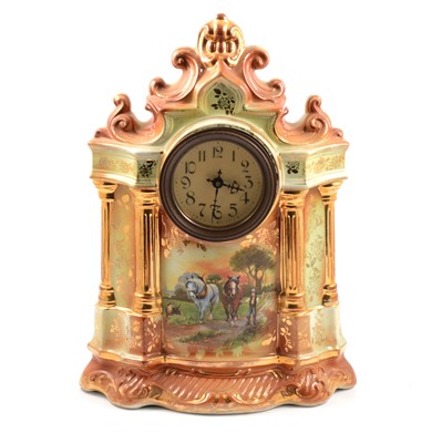 Lot 185 - Staffordshire pottery clock garniture
