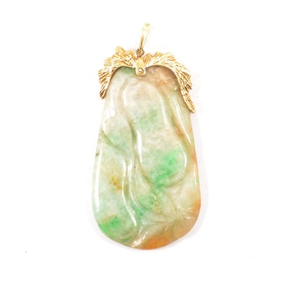 Lot 229 - A variable coloured jade pendant with 18K mount.