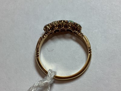 Lot 51 - An opal and diamond half hoop ring.