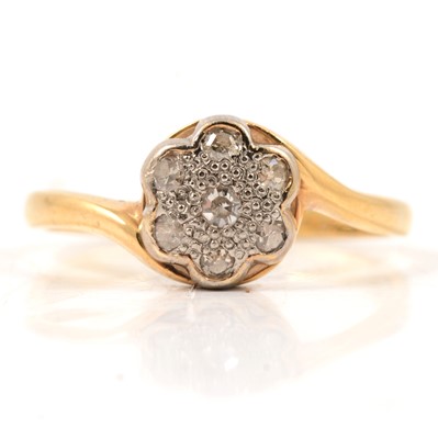 Lot 21 - A vintage diamond cluster crossover ring.