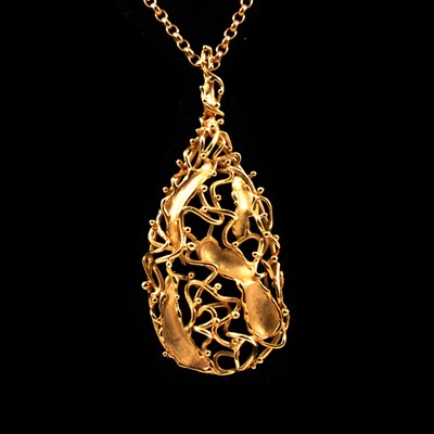 Lot 176 - A modern abstract 9 carat gold pendant and chain.