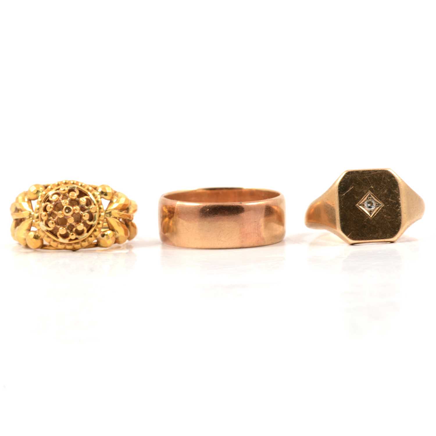 Lot 67 - Three yellow metal rings.