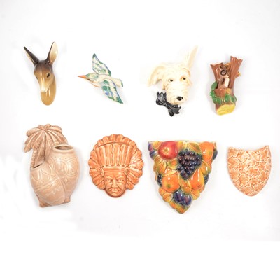 Lot 93 - Four animal wall plaques, four wall pockets, and four posy holders.