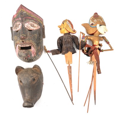Lot 174 - Two Indonesian puppets, two tribal masks, and a plaque