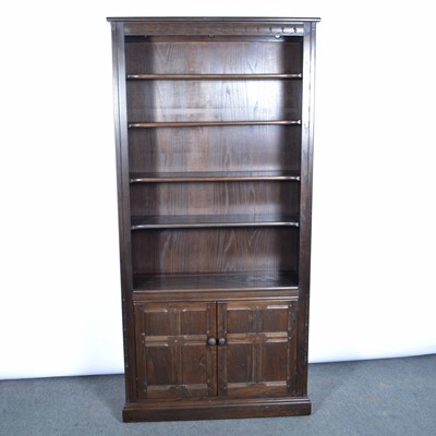 Lot 340 - Ercol dark elm bookcase and an Ercol bedside table