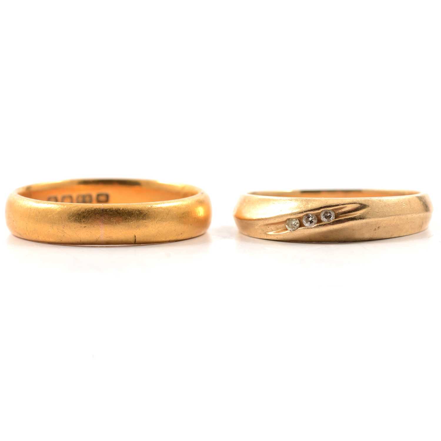 Lot 83 - A 22 carat gold wedding band and 10K ring.