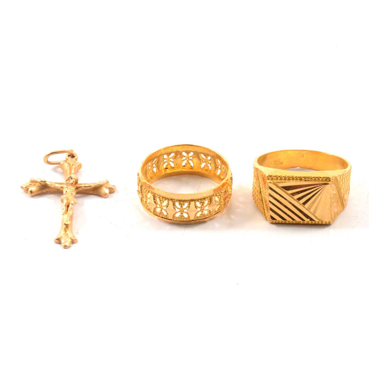 Lot 68 - Two yellow metal rings and a crucifix.