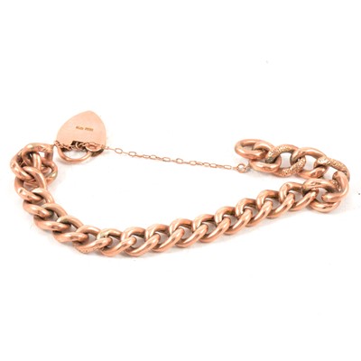 Lot 171 - A rose metal hollow curb link bracelet with padlock fastener.