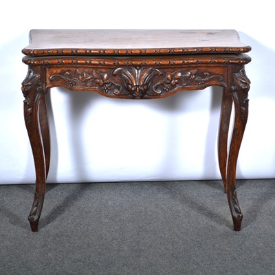 Lot 384 - German carved oak card table