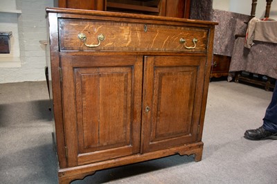 Lot 210 - George III oak cupboard