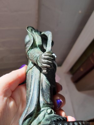 Lot 103 - An Oriental patinated bronze dragon deity
