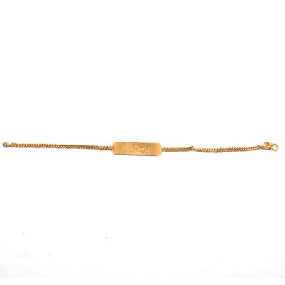 Lot 126 - A yellow metal identity bracelet.