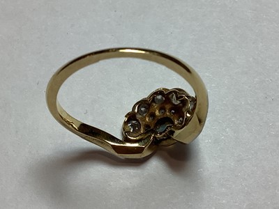 Lot 48 - An opal and diamond fan shaped ring.