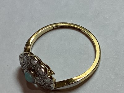 Lot 48 - An opal and diamond fan shaped ring.