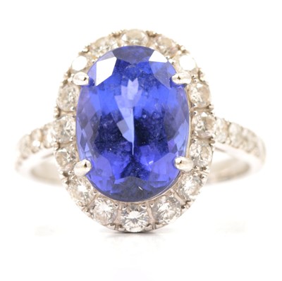 Lot 44 - A tanzanite and diamond cluster ring.