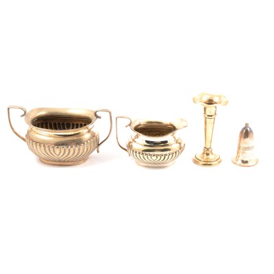 Lot 199 - Three-piece silver-plated teaset, spill vases; salts; fish servers and eaters and other plated wares.