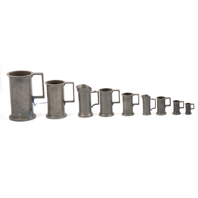 Lot 117 - Graduated set of five pewter tankards, two other small tankards and two jugs.