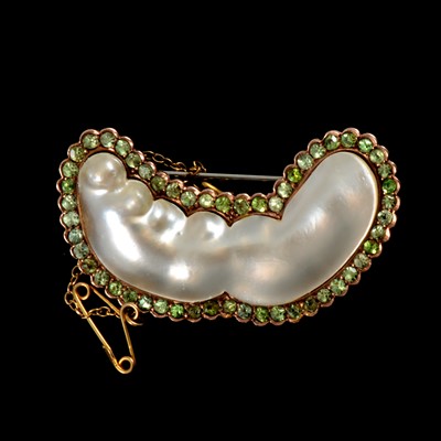 Lot 153 - A pearl and demantoid garnet brooch.