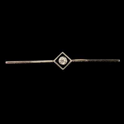Lot 151 - A diamond solitaire bar brooch.