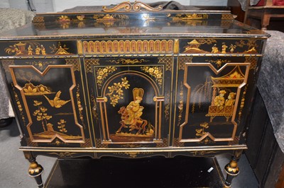 Lot 247 - Black ground Chinoiserie side cupboard