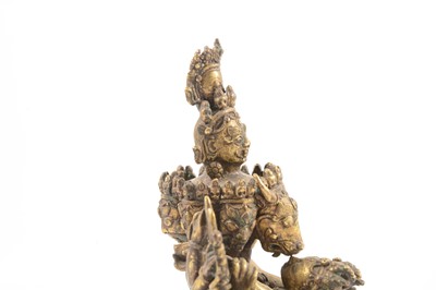 Lot 160 - A Tibetan gilt-copper group