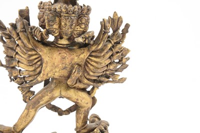 Lot 160 - A Tibetan gilt-copper group