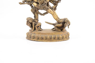 Lot 160 - A Tibetan gilt-copper group