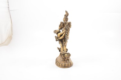 Lot 160 - A Tibetan gilt-copper group