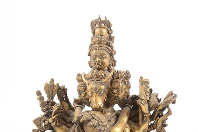 Lot 160 - A Tibetan gilt-copper group