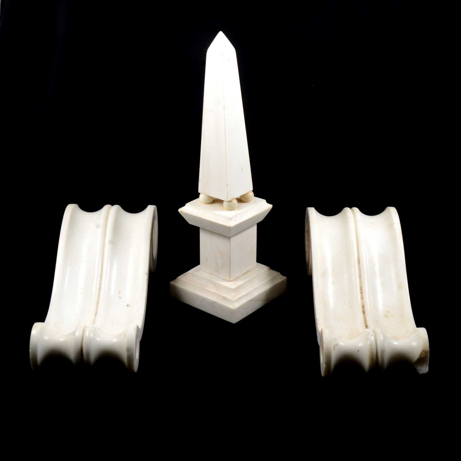 Lot 61 A white marble obelisk and a pair of corbels