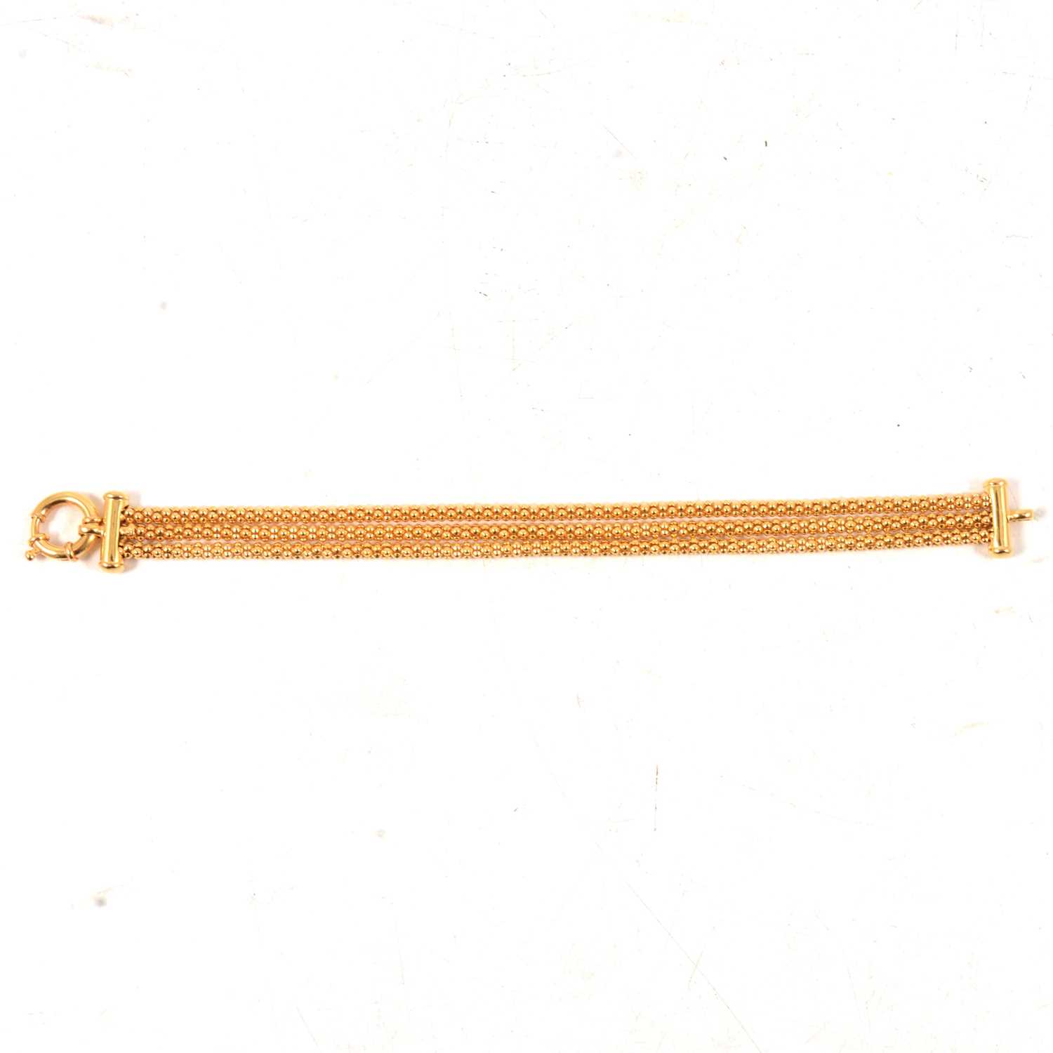 Lot 168 - A 9 carat yellow gold three strand bracelet.