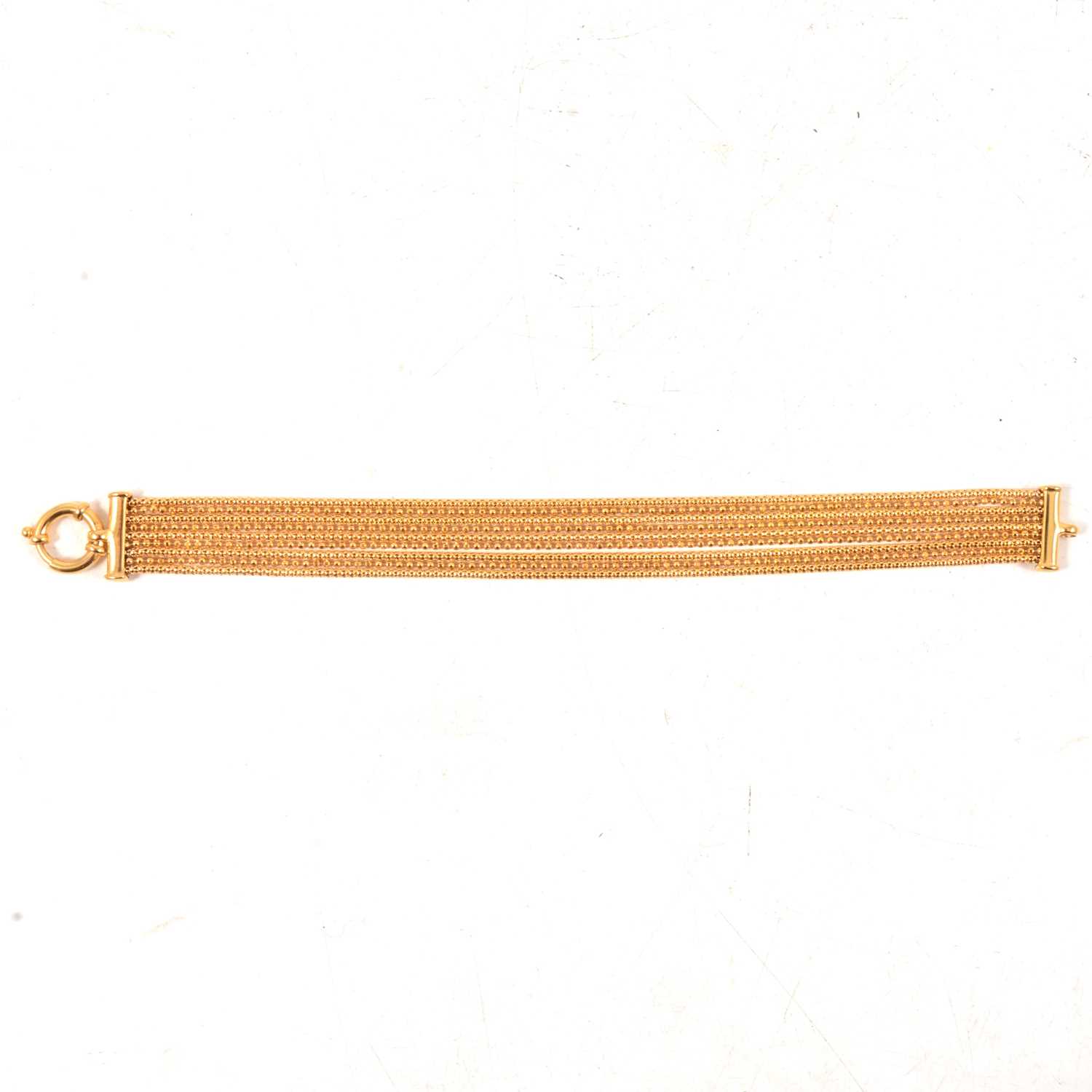 Lot 167 - A 9 carat yellow gold nine strand bracelet.