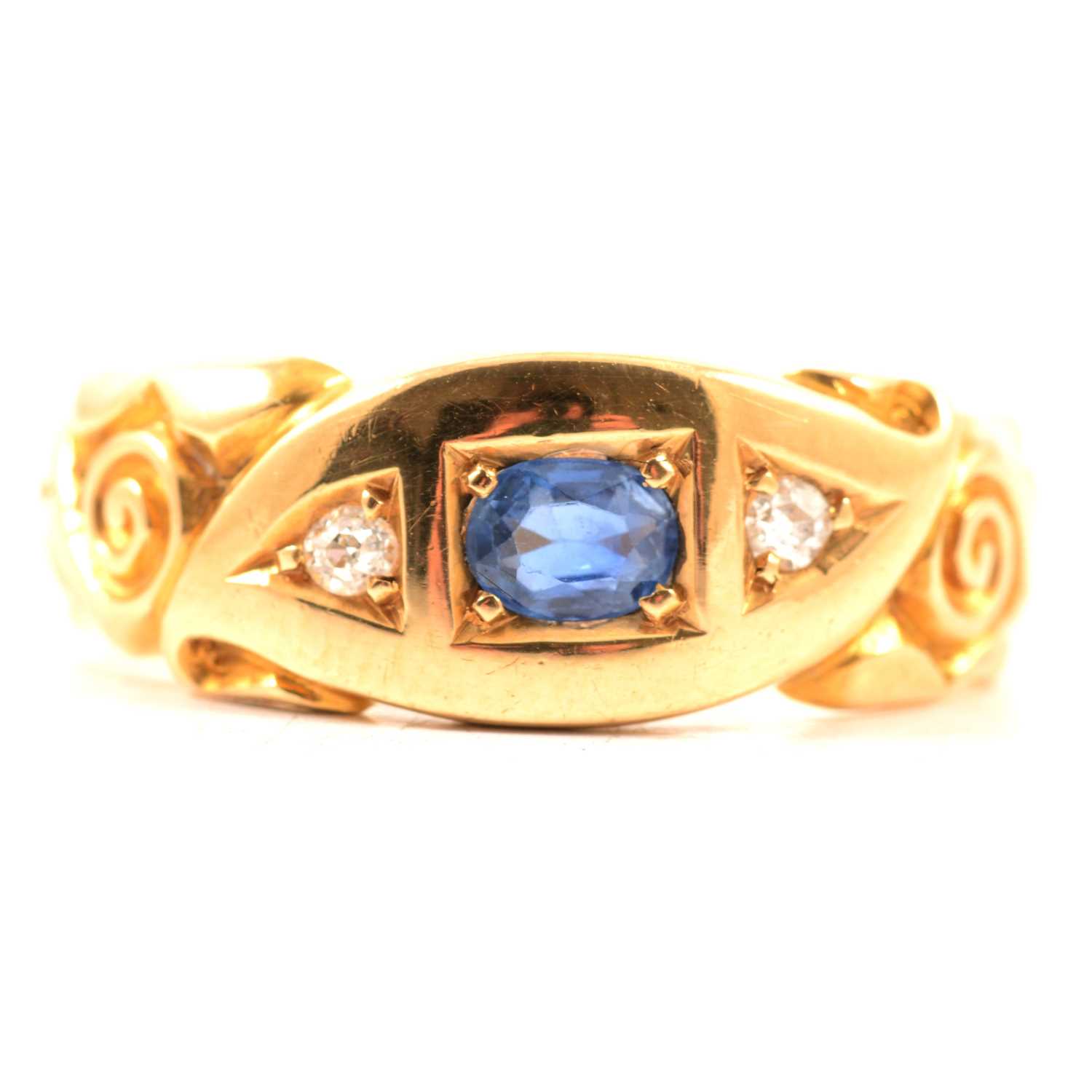 Lot 53 - A sapphire and diamond ring.