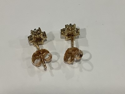 Lot 137 - A pair of small diamond cluster earrings.