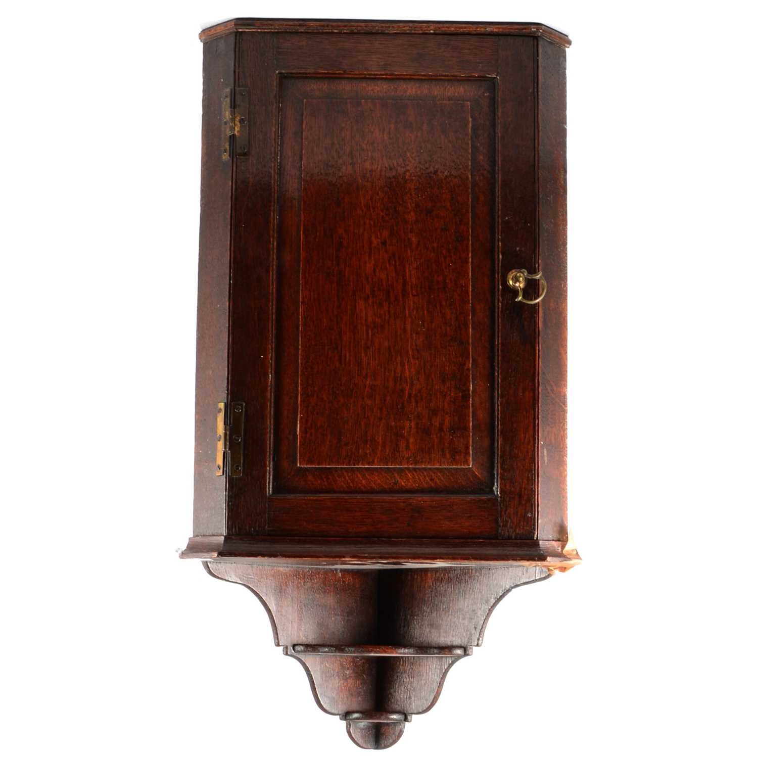 Lot 94 - A small George III oak hanging corner cupboard