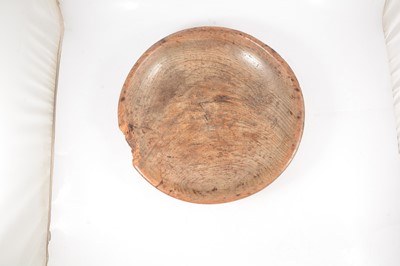 Lot 63 - An old elm cream settling bowl