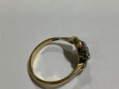 Lot 16 - A diamond three stone crossover ring.