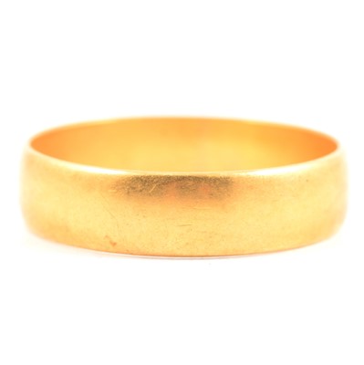 Lot 203 - A 22 carat yellow gold wedding band.