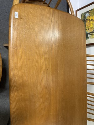 Lot 1099 - Ercol, a fixed top dining table