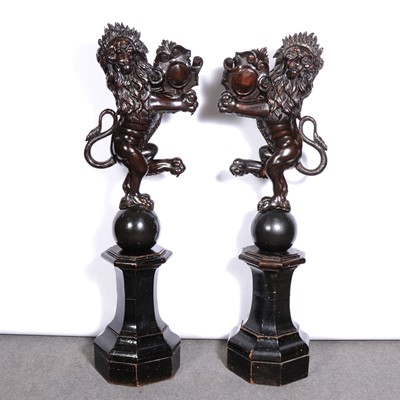 Lot 244 - Pair of Victorian ebonised armorial lions