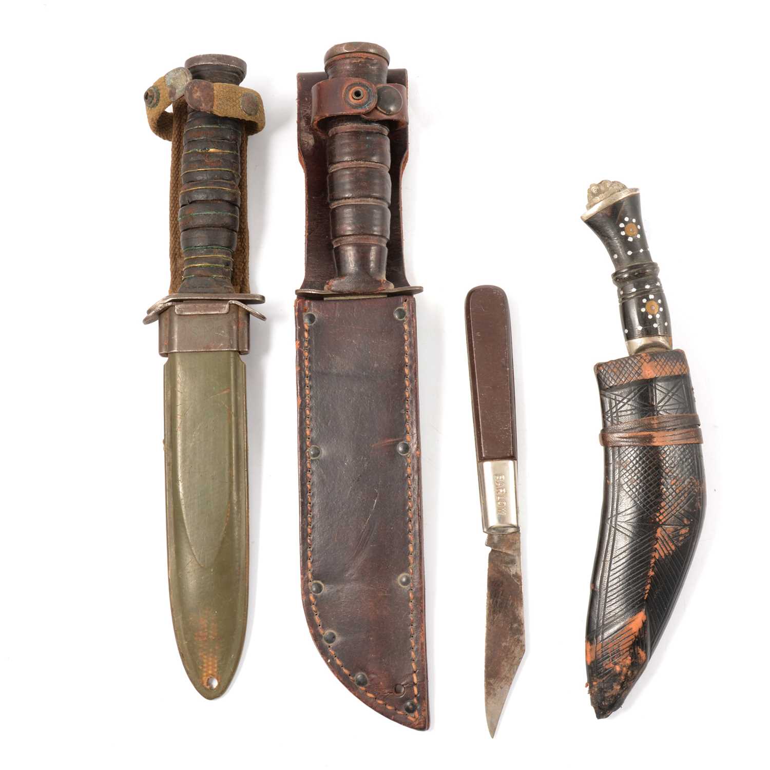 Lot 206 - Two American Army combat knives, a kukri knife, and another.