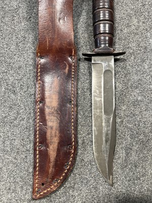 Lot 206 - Two American Army combat knives, a kukri knife, and another.