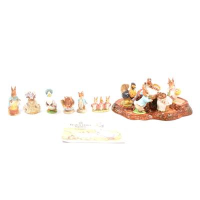 Lot 11 - Beswick- twenty Beatrix Potter figures and display stand