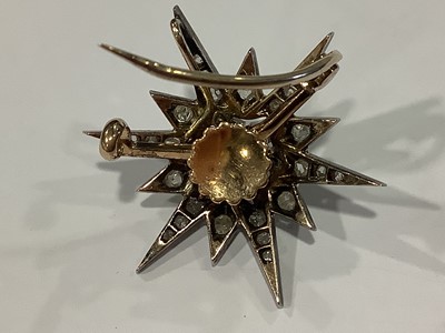 Lot 149 - A Victorian diamond star brooch/pendant.